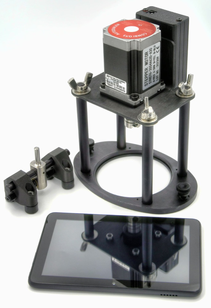Combi QX3 autodialer: stepper motor on a four-post frame, dial chuck, and the control tablet