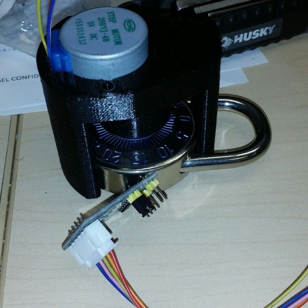 Combination Lock Cracker: stepper motor in a black 3D-printed housing fitted over a padlock dial